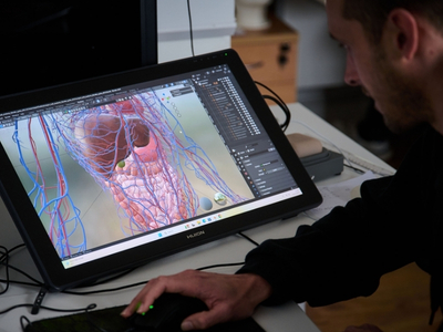 AnthroTek engineer working on an anatomical model in the workshop