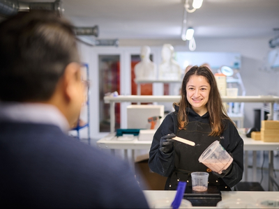 AnthroTek team member working with silicone materials in the laboratory
