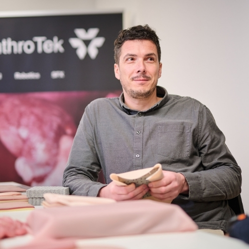AnthroTek co-founder demonstrating biomimetic skin substrate samples
