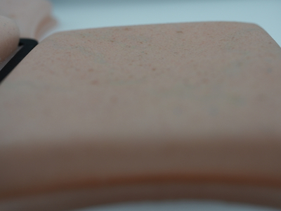 AnthroPad synthetic silicone skin texture close-up for medical training simulation